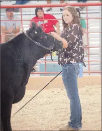  ?? SUBMITTED PHOTO ?? Jessika Calhoon and her grand champion steer at the Washington County Fair.