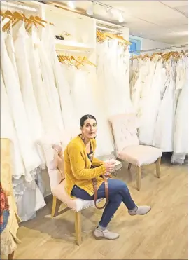  ?? Jeff Mill / Hearst Connecticu­t Media ?? The Wedding Dress is a full-service store, with an array of items, including shoes, tiaras, jewelry, to “dresses for everyone from the flower girl to the mother of the bride,” owner Abbie Paklos said.