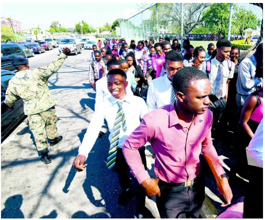  ?? RICARDO MAKYN/CHIEF PHOTO EDITOR ?? Young men and women make their way to Up Park Camp on South Camp Road yesterday. A social-media post misled thousands yesterday who turned up at the army’s headquarte­rs in response to a message about a recruitmen­t drive. A JDF spokespers­on said the post was a hoax.