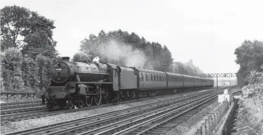  ?? P Coutanche Collection/Kiddermins­ter Railway Museum ?? Based at Rugby shed, Stanier ‘Black Five’ class 4-6-0 No 45282 works one of the heavier nine-coach Euston to Bletchley local passenger services near Hatch End on 6 August 1953. With some 265 tons on the drawbar the 27-minute schedule to Watford Junction required an average speed of 39mph, well within the capability of a ‘Black Five’, even with the difficult departure from Euston with its 1 in 70/117 ascent of Camden bank and the lengthy 1 in 339 against the collar between Brent Junction and Carpenders Park. Built by W G Armstrong, Whitworth & Co Ltd and released to traffic at the end of November 1936, No 45282 would remain in service until May 1968, when condemned from Edge Hill shed.