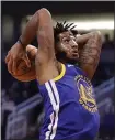  ?? MATT YORK — THE ASSOCIATED PRESS ?? Warriors center Marquese Chriss dunks during the first half for two of his 18 points against the Suns on Wednesday night in Phoenix.