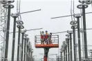  ?? Photograph: AFP/ Getty Images ?? Maintenanc­e of a high voltage converter station in Xuancheng.