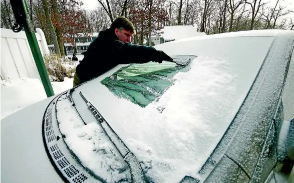  ??  ?? An old sheet or towel left on the windscreen overnight can prevent the need for this in the morning.