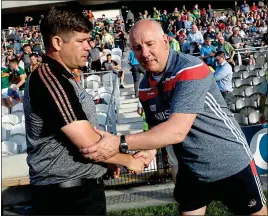  ??  ?? RESPECT: Éamonn Fitzmauric­e shakes hands with Cork’s Ronan McCarthy