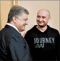  ?? AP/MYKOLA LAZARENKO ?? Ukrainian President Petro Poroshenko (left) and Russian journalist Arkady Babchenko meet Wednesday in Kiev, Ukraine. Babchenko apologized for his staged death a day earlier.