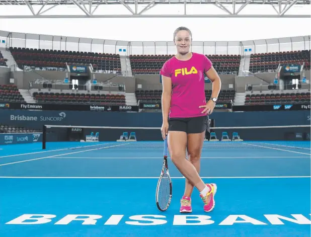  ??  ?? CLIMB AHEAD: Queensland tennis player Ashleigh Barty at Tennyson ahead of the Brisbane Internatio­nal for which she has scored a wildcard entry. Picture: PETER WALLIS