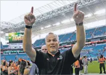  ?? LYNNE SLADKY THE ASSOCIATED PRESS ?? Miami head coach Mark Richt walks off the field after Saturday’s game against Virginia in Miami Gardens, Fla. Miami won 44-28. Miami made a small but potentiall­y significan­t move up to No. 2 behind Alabama in the College Football Playoff rankings on...