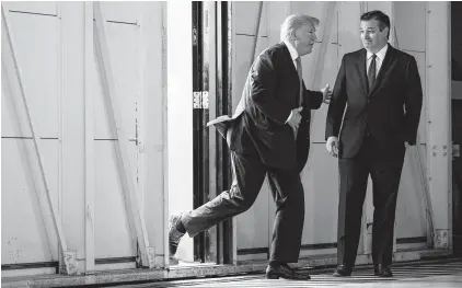  ?? Evan Vucci / Associated Press ?? Sen. Ted Cruz, R-Texas, waits as President Donald Trump arrives to meet with families of the Santa Fe school shooting at Coast Guard Air Station Houston in May. Trump recently tweeted his endorsemen­t of Cruz.