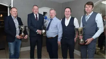 ?? ?? Maurice Field, Chairman, Lismire GAA makes a presentati­on to retiring football coach Maurice Angland in the comany of team management Paudie Denn, James O’Neill and Tim Aherne at the club victory function. All photos by John Tarrant.