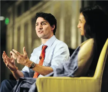 ?? SEAN KILPATRICK / THE CANADIAN PRESS ?? Prime Minister Justin Trudeau takes part in a discussion with Chanda Kochhar of the Industrial Credit and Investment Corp. of India at business forum on Tuesday.