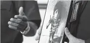  ?? Jennifer Reynolds / Galveston Daily News ?? Galveston Police Detective Jeff Banks holds a photo of 4-year-old Jayden Alexander Lopez.