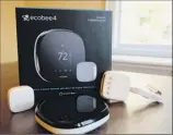  ?? Cathy Bussewitz / Associated Press ?? Smart thermostat­s let consumers adjust their home temperatur­es remotely using any internet-connected device.