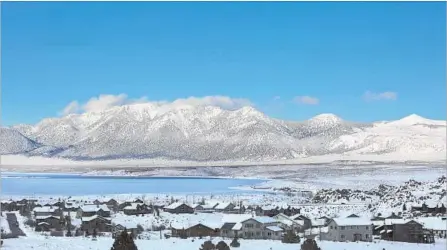  ?? Photograph­s by Brian van der Brug Los Angeles Times ?? A BREAK on Monday in a series of storms moving across California highlights the snow-covered White Mountains near Crowley Lake.