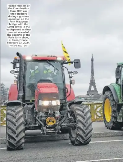  ?? Picture: REUTERS ?? French farmers of the Coordinati­on Rural (CR) use their tractors during a go-slow operation on the Pont Mirabeau bridge with the Eiffel Tower in the background as they protest ahead of the openiNg of the Paris farm show, in Paris, France, February 23, 2024.
