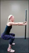  ??  ?? Lee Ann Jolly, physiologi­st and trainer at Little Rock Athletic Club, does the Sword Squat.