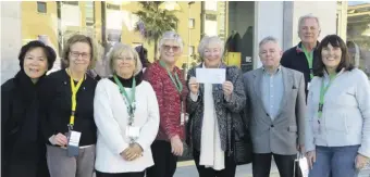  ?? Photo: OCSL ?? The cheque presentati­on to Liz Trafford and John Harris of JFCA