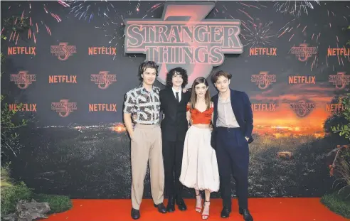  ?? Picture: GETTY IMAGES FOR NETFLIX ?? TOP BILLING: Joe Kerry, Finn Wolfhard, Natalia Dyer and Joe Kerry star in Stranger Things on Netflix.