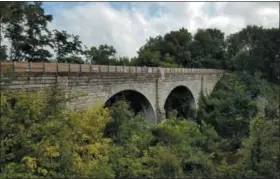  ?? PHOTO COURTESY OF FIRELANDS RAILS TO TRAILS, INC. ?? Firelands Rails to Trails along with volunteers and local dignitarie­s celebrated the grand opening of the Bruce L. Chapin Bridge on Aug. 18 in Wakeman along with the re-routing of the Buckeye Trail to the North Coast Inland Trail via the bridge.