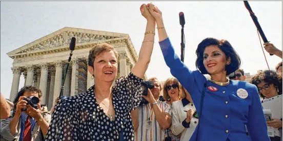  ?? J. SCOTT APPLEWHITE/AP 1989 ?? Norma McCorvey (left), Jane Roe in the 1973 court case, and her attorney Gloria Allred leave the Supreme Court in Washington in April 1989 after sitting in as the court heard arguments in a Missouri abortion case. The court now could be poised to overturn the right to abortion, letting states more heavily regulate or even ban the procedure.