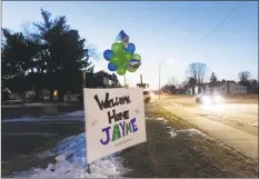  ?? Kerem Yucel / AFP / Getty Images ?? A “Welcome Home Jayme” sign displayed for Jayme Closs on Friday in Barron, Wis., one day after the missing teenager was found coming out of nearby woods with her hair matted and wearing oversized shoes.