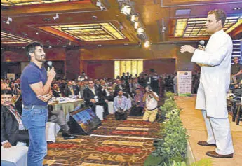  ?? PTI ?? Congress vicepresid­ent Rahul Gandhi interacts with boxer Vijender Singh at the 112th PHD Chamber's Annual Session & Awards for Excellence 2017 in New Delhi on Thursday.