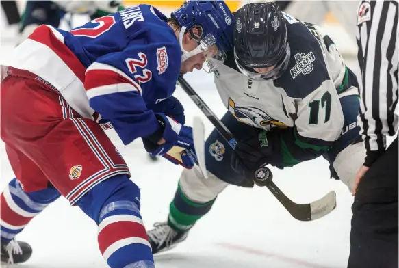  ?? CITIZEN PHOTO BY JAMES DOYLE ?? Prince George Spruce Kings forward Fin Williams and Surrey Eagles forward Hudson Schandor keep their eyes on the puck during a faceoff Saturday night at Rolling Mix Concreate Arena. It wasn’t the start the Kings hoped for to the regular season as they were swept by the Eagles in the weekend series, losing 4-2 on Friday and 4-3 in overtime on Saturday.