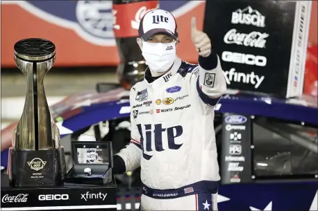  ?? GERRY BROOME — THE ASSOCIATED PRESS ?? Brad Keselowski celebrates after winning the NASCAR Cup Series auto race at Charlotte Motor Speedway early Monday in Concord, N.C.