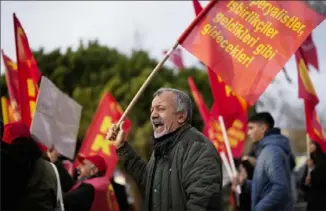  ?? Francisco Seco/Associated Press ?? Supporters of the People’s Liberation Party, a communist group, shout slogans during a small protest Saturday in Istanbul against U.S. Secretary of State Antony Blinken’s visit to Turkey. Mr. Blinken is trying to prevent the broadening of the Israel-Hamas war.