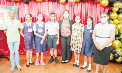  ??  ?? Some of the Guyana Learning Channel’s Whiz Kids game show contestant­s pose with the Minister of Education, Priya Manickchan­d during the official launch of the show at NCERD on Friday (Ministry of Education Photo)