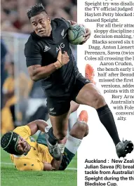  ??  ?? Auckland : New Zealand's Julian Savea (R) breaks the tackle from Australia's Henry Speight during the third rugby Bledisloe Cup.