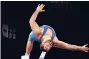  ?? EZRA SHAW/GETTY ?? Gable Steveson celebrates his win in the freestyle 125-kilogram class final with a backflip Friday.