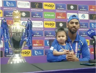  ?? — PHOTO BY RITURAJ BORKAKOTY ?? MI Emirates skipper Nicholas Pooran with his one-year-old daughter at the press conference on Saturday.