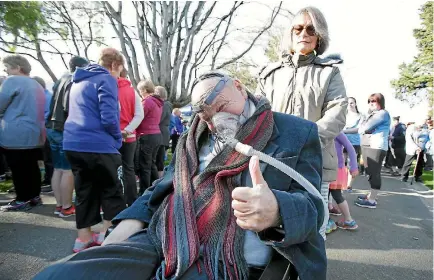  ?? ROBYN EDIE/FAIRFAX NZ 633158450 ?? Invercargi­ll couple Greg and Francesca Douglas take part in the Walk 2 D’Feet MND (motor neuron disease) event held at Queens Park in Invercargi­ll yesterday morning. The large crowd walked from Feldwick Gates to Herbert St and back.