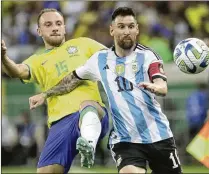  ?? BRUNA PRADO/AP ?? Forward Lionel Messi (right), who led Argentina to the World Cup championsh­ip in 2022, is expected to play for the national team when it competes in the Copa America tournament beginning June 20. Argentina will play at least one game in Atlanta.