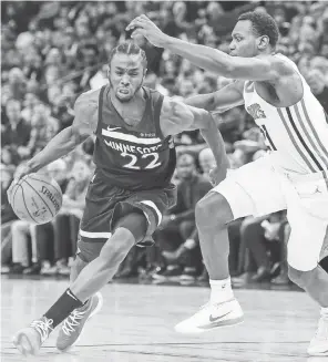  ?? JEFFREY BECKER/USA TODAY SPORTS ?? Forward Andrew Wiggins, left, and the Timberwolv­es have won five in a row for the first time since January 2009.