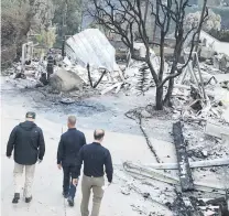  ?? PHOTO: TNS ?? On the spot . . . President Donald Trump (left) tours a fireravage­d neighbourh­ood in Malibu yesterday.