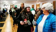  ?? AP PHOTO BY MATHEW SUMNER ?? Margot Simpson, right, and Diana Gladden wait in line to purchase marijuana at Harborside marijuana dispensary, Monday in Oakland.