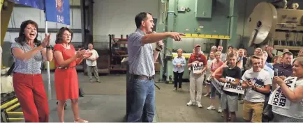  ?? MICHAEL SEARS/MSEARS@JOURNALSEN­TINEL.COM ?? Gov. Scott Walker, Lt. Gov. Rebecca Kleefisch (left) and Republican U.S. Senate candidate Leah Vukmir attend a rally Wednesday at Miro Stamping in Waukesha.