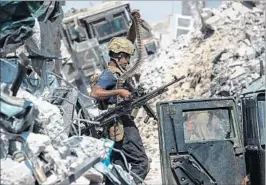  ?? FADEL SENNA/GETTY-AFP ?? An Iraqi soldier walks in Mosul’s Old City on Monday as the government ended a nearly nine-month campaign to retake the city from Islamic State. Thousands died in the effort.