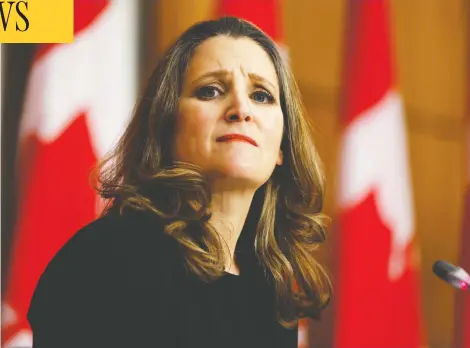  ?? BLAIR GABLE / REUTERS ?? Finance Minister Chrystia Freeland speaks to the media before unveiling her first fiscal update in Ottawa on Monday. The Fall Economic Statement 2020 includes as much as $100 billion in spending to help keep cushion Canadians from the pandemic's economic effects.