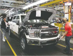  ?? REBECCA COOK / REUTERS FILES ?? Ford has slowed down production of its bread-and-butter F-150 in both Kansas City, Mo., and Dearborn, Mich., above, due to a tight supply of chips for vehicle systems.