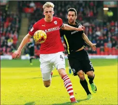  ??  ?? STAY BACK: Barnsley’s Marc Roberts keeps Sam Baldock at bay