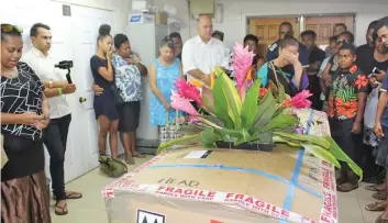  ??  ?? The casket of the late Thomas Riley with family and the Fijian community in Rarotonga.