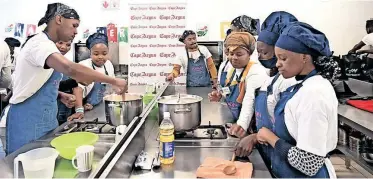  ?? ?? CULINARY students show off their skills during a cook-off challenge at The Amy Foundation in Gugulethu yesterday.