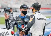  ?? NELL REDMOND/ASSOCIATED PRESS ?? Kevin Harvick, left, pictured talking to Aric Almirola, has won the past three fall races at Texas.