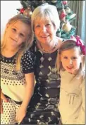  ??  ?? Val enjoying Christmas with grandchild­ren Jessica and Phoebe