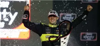  ?? AP PHOTO/RALPH FRESO ?? Austin Cindric celebrates in victory lane at Phoenix Raceway after winning the Xfinity Series finale and the season championsh­ip on Saturday in Avondale, Ariz.