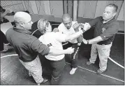  ?? JULIO CORTEZ/ASSOCIATED PRESS ?? A former Marine, Victor Ransom (second from right) goes through police training in Jersey City, New Jersey.