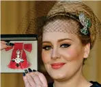  ?? ?? Grand: Adele shows off her MBE