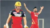  ??  ?? PK’S Harpreet Brar (R) returned figures of 3/19 bagging the prized scalps of Virat Kohli, Glenn Maxwell and AB de Villiers.